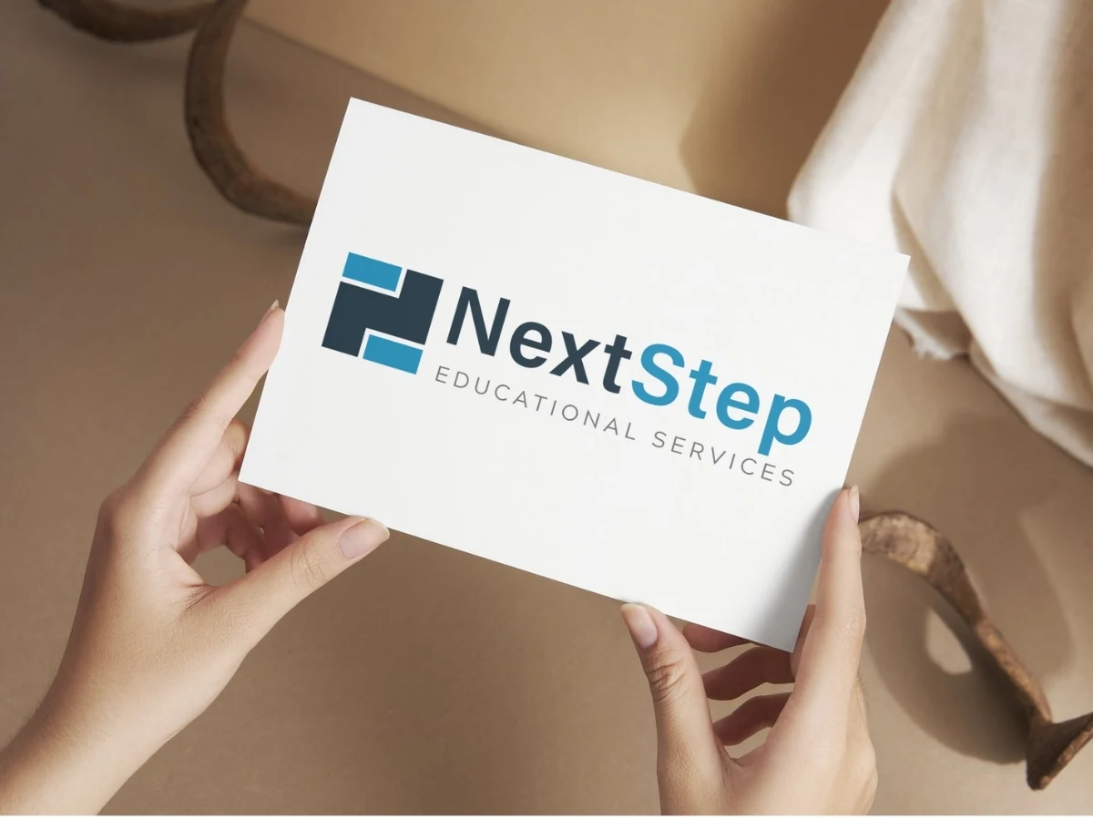 NextStep Educational Services blue and charcoal logo on a white card