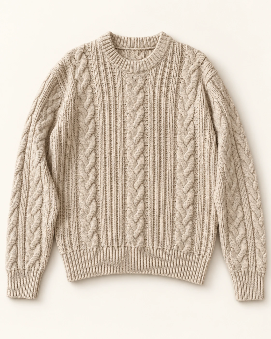 The same oatmeal sweater with a clean studio background, refined styling, and detailed natural knit texture