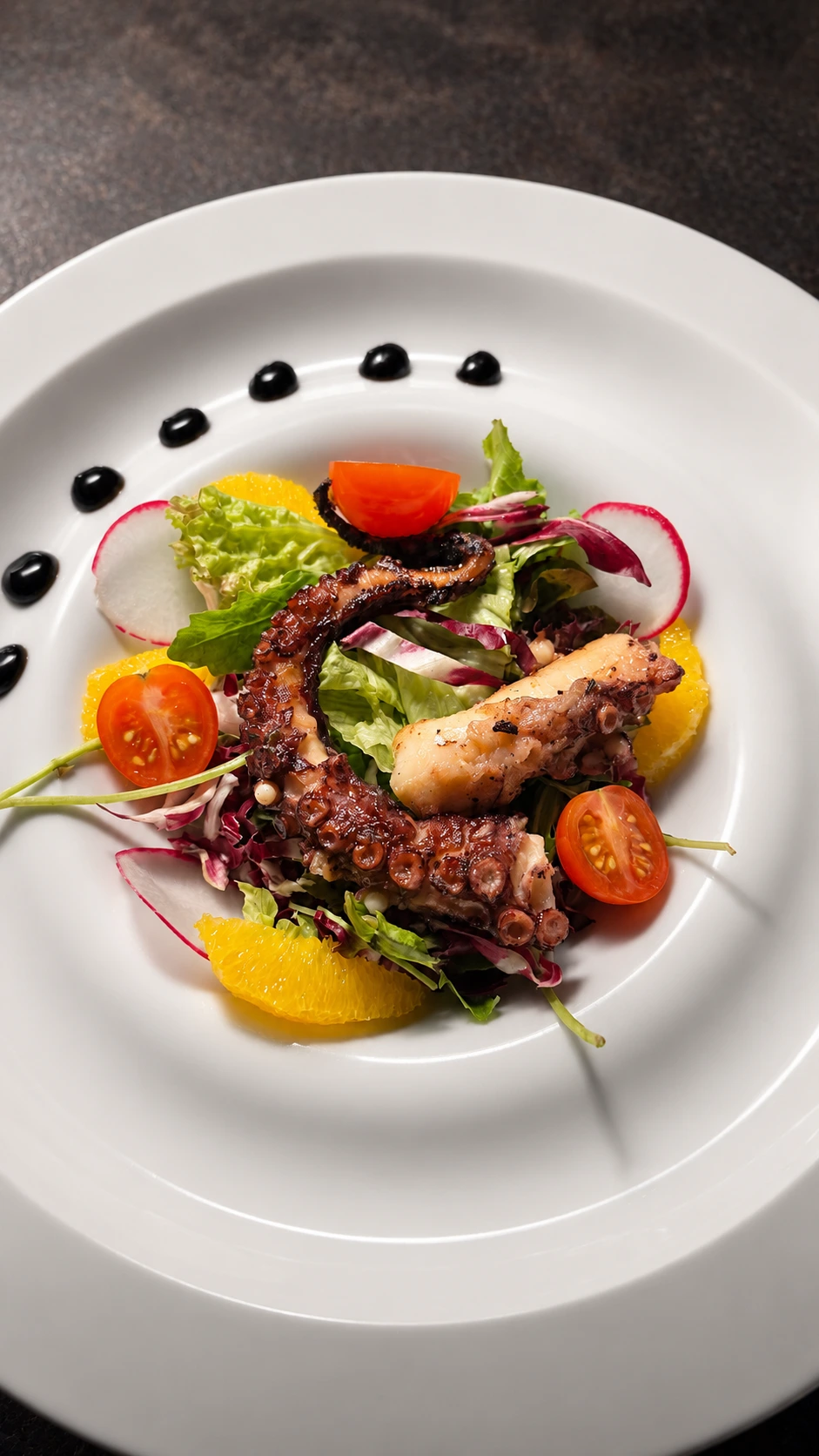 Edited octopus salad with dramatic restaurant lighting and refined color